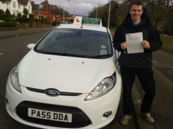 Henriq Proudly holding his Pass Certificate.  An outstanding drive a 