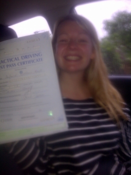Proudly holding her Pass Certificate. A great drive in heavy rain, hence the picture taken in the car....
